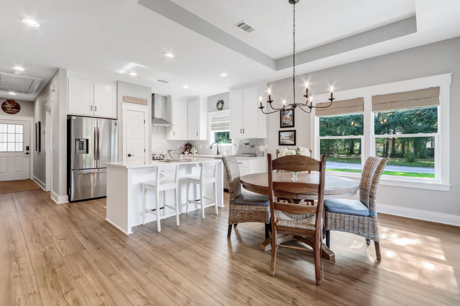 Open-concept kitchen and dining area staged at Beech Street, Fernandina Beach